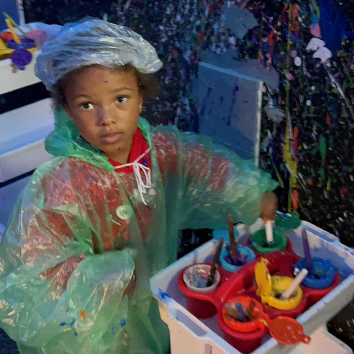 a small child sitting on a table